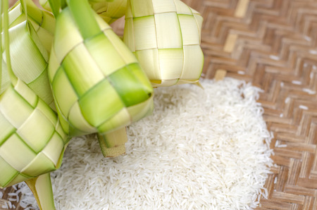 ketupat casing and rice in bamboo container. traditional malay delicacy during Malaysian eid festivalの写真素材