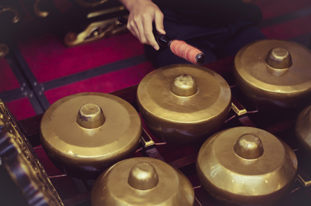 Malaysian traditional music instrument called Gamelan with beautiful wood carving frame. selective focus shotの写真素材