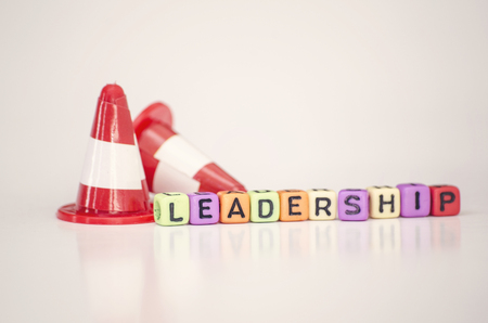 Business success and motivational concept dices cube with word LEADERSHIP with reflection.selective...