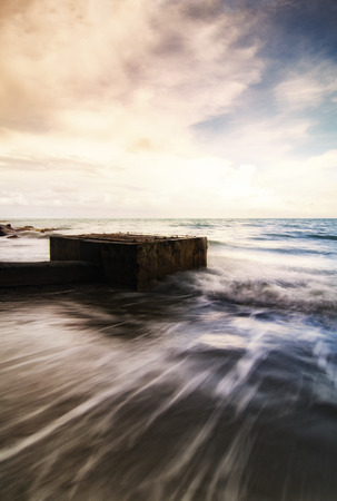 fantasy image of beach with sunlight effect, soft wave hitting the shoreの写真素材