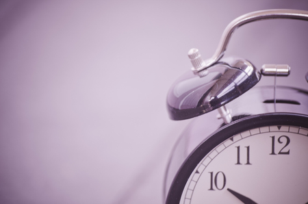Cropped and closeup  vintage alarm clock for time management conceptの写真素材
