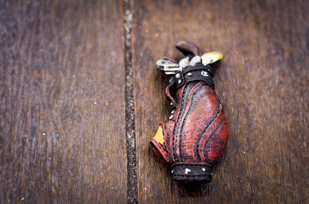 leisure and active concept, golf set miniature on wooden backgroundの写真素材