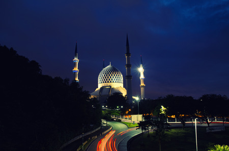 The beautiful Sultan Salahuddin Abdul Aziz Shah Mosque over stunning sunrise background. soft focus and low light shotの写真素材
