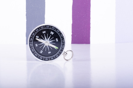 compass on reflective surface for business direction and travel concept backgroundの写真素材