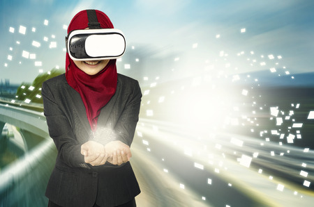 Creative ideas concept, successful young muslimah businesswomen wearing virtual reality headset ...