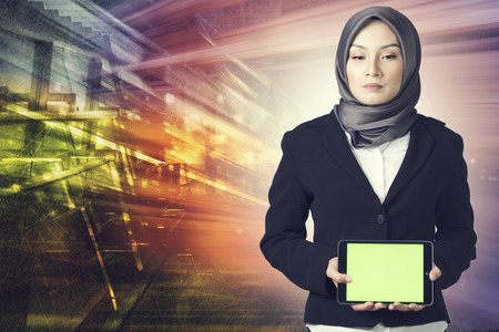 Creative ideas for technology concept , young entrepreneur holding a tablet over network connection futuristic background, の写真素材