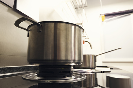 empty stainless steel pot on gas stoveの写真素材