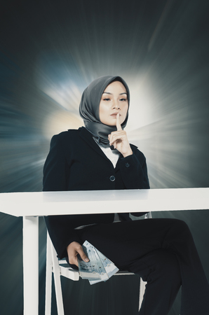 corruption concept, young women try to bribe somebodyの写真素材