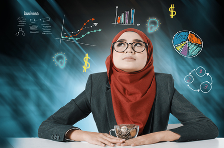 Business analysis concept, young women thinking over abstract background with symbolsの写真素材