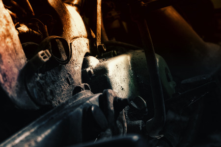 closeup abstract background, rusty old motorcycle under low light. noise ,grain and light effectの写真素材