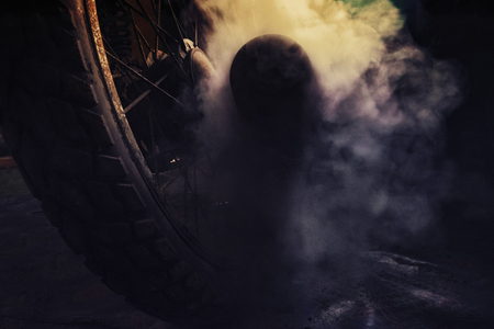 closeup abstract background, rusty old motorcycle under low light with noise, grain and smoke effect の写真素材