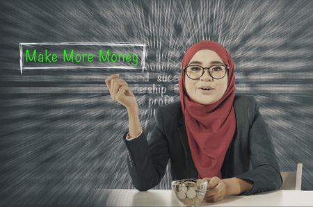 smile face young women with word MAKE MORE MONEY conceptの写真素材