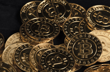 Conceptual image for worldwide cryptocurrency, huge stack physical version of golden Bitcoinの写真素材