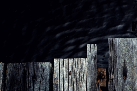 old jetty plank over dark backgroundの写真素材
