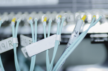 Data transfer by optical fibre on core network switch. selective focus shot