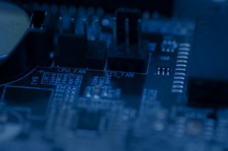selective focus effect and macro view of the group of electronic components on mainboard circuit...