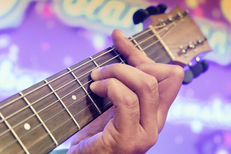 close-up and selective focus shot image of hand playing electric guitar.grain and noise effect