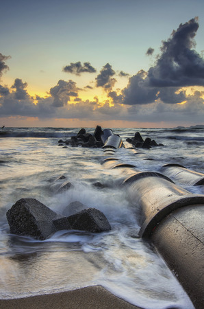 Travel And vacation concept background, beautiful tropical beach sunrise sea view. soft wave hitting sandy beachの写真素材