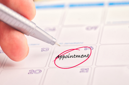 handwriting word, APPOINTMENT on calendar for time management and planning conceptの写真素材