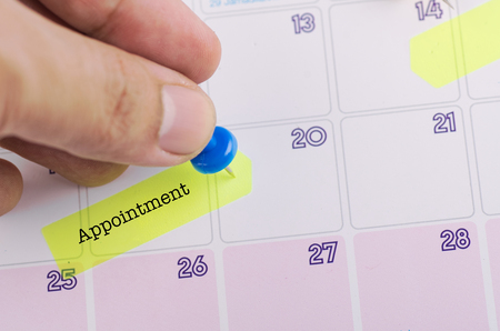 word APPOINTMENT on calendar for time planning or business conceptの写真素材
