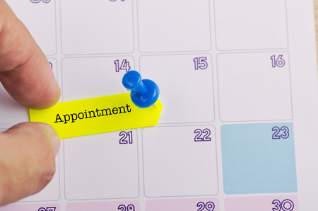 word APPOINTMENT on calendar for time planning or business conceptの写真素材