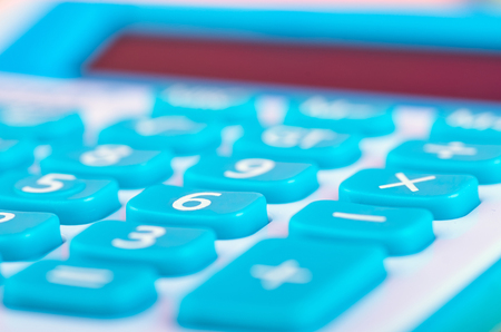 close-up and selective focus shot, calculator on wooden deskの写真素材