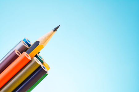 close-up image of colourful pencils over beautiful reverberation gradient backgroundの写真素材