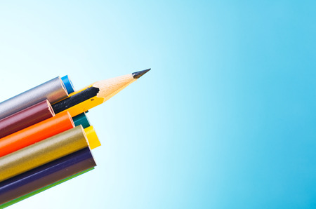 close-up image of colourful pencils over beautiful reverberation gradient backgroundの写真素材