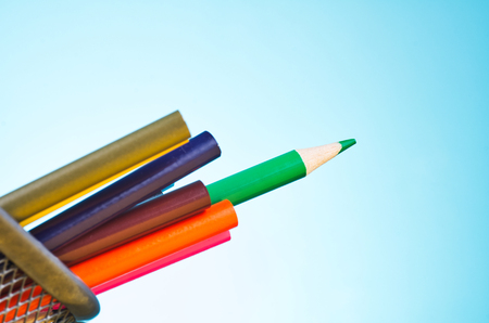 close-up image of colourful pencils over beautiful reverberation gradient backgroundの写真素材