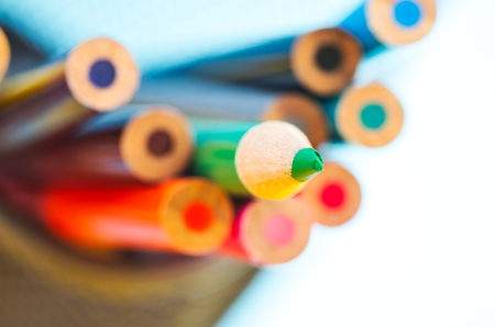 close-up image of colourful pencils over beautiful reverberation gradient backgroundの写真素材