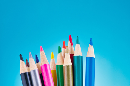 close-up image of colourful pencils over beautiful reverberation gradient backgroundの写真素材