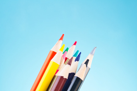 close-up image of colourful pencils over beautiful reverberation gradient backgroundの写真素材