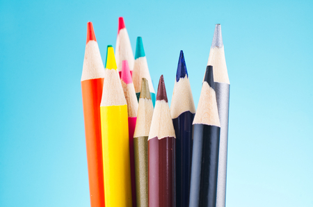 close-up image of colourful pencils over beautiful reverberation gradient backgroundの写真素材