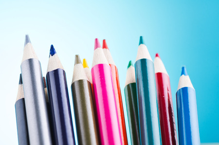 close-up image of colourful pencils over beautiful reverberation gradient backgroundの写真素材