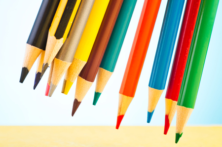close-up image of colourful pencils over beautiful reverberation gradient backgroundの写真素材