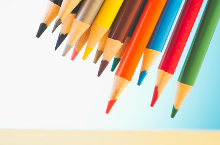 close-up image of colourful pencils over beautiful reverberation gradient backgroundの写真素材