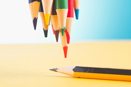 close-up image of colourful pencils over beautiful reverberation gradient backgroundの写真素材