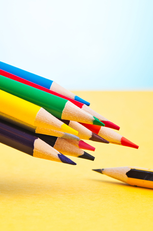 close-up image of colourful pencils over beautiful reverberation gradient backgroundの写真素材