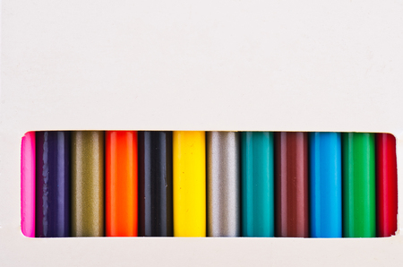 close-up image of colourful pencils in the white boxの写真素材