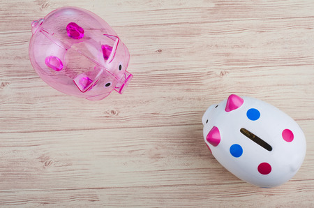 financial crisis concept, empty piggy bank over wooden backgroundの写真素材