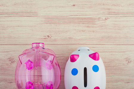 financial crisis concept, empty piggy bank over wooden backgroundの写真素材