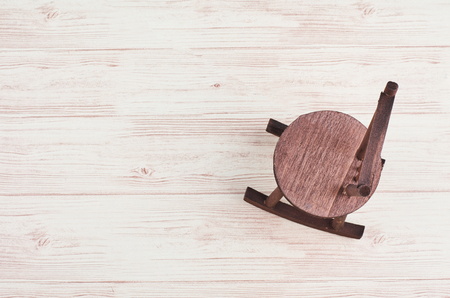 Mininature old rocking chair on wooden backgroundの写真素材