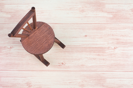 Mininature old rocking chair on wooden backgroundの写真素材