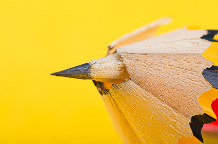 graphite wooden pencil on yellow backgroundの写真素材