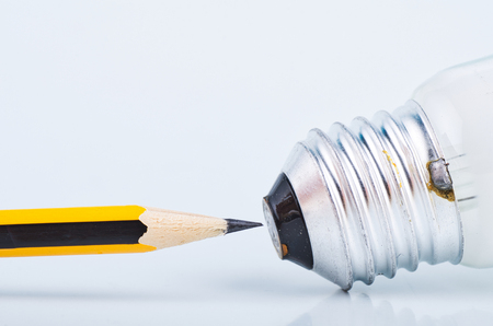pencil and bulb over white background for creative ideas conceptの写真素材