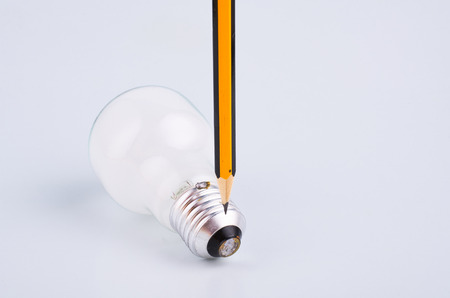 pencil and bulb over white background for creative ideas conceptの写真素材
