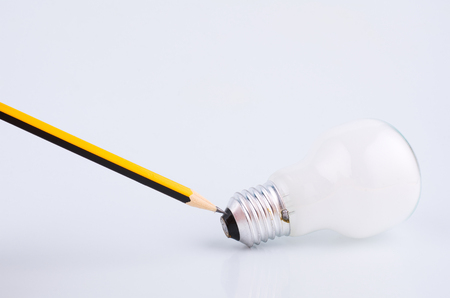 pencil and bulb over white background for creative ideas conceptの写真素材