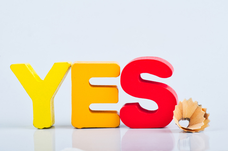 motivation to be sincere and kind concept, word YES on white reflection backgroundの写真素材
