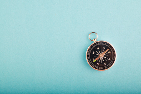 compass on blue background for travel or direction concept.copy space for textの写真素材
