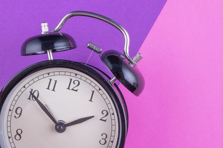 Time management concept, alarm clock on purple background. copy space for textの写真素材